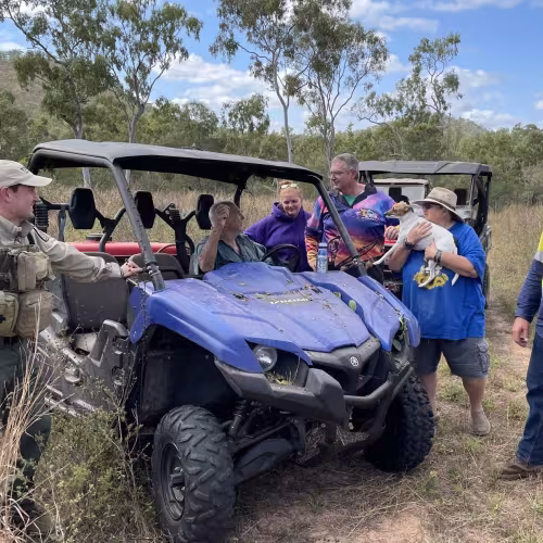 QRAT team member talks to members of community
