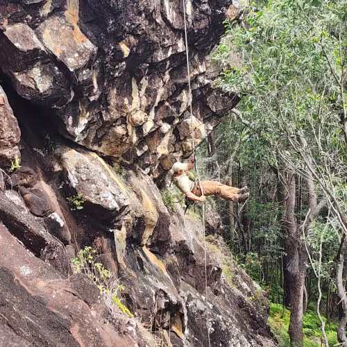 Rapelling down cliff in SEQ
