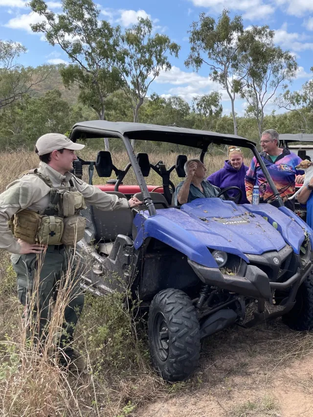 QRAT team member talks to community members